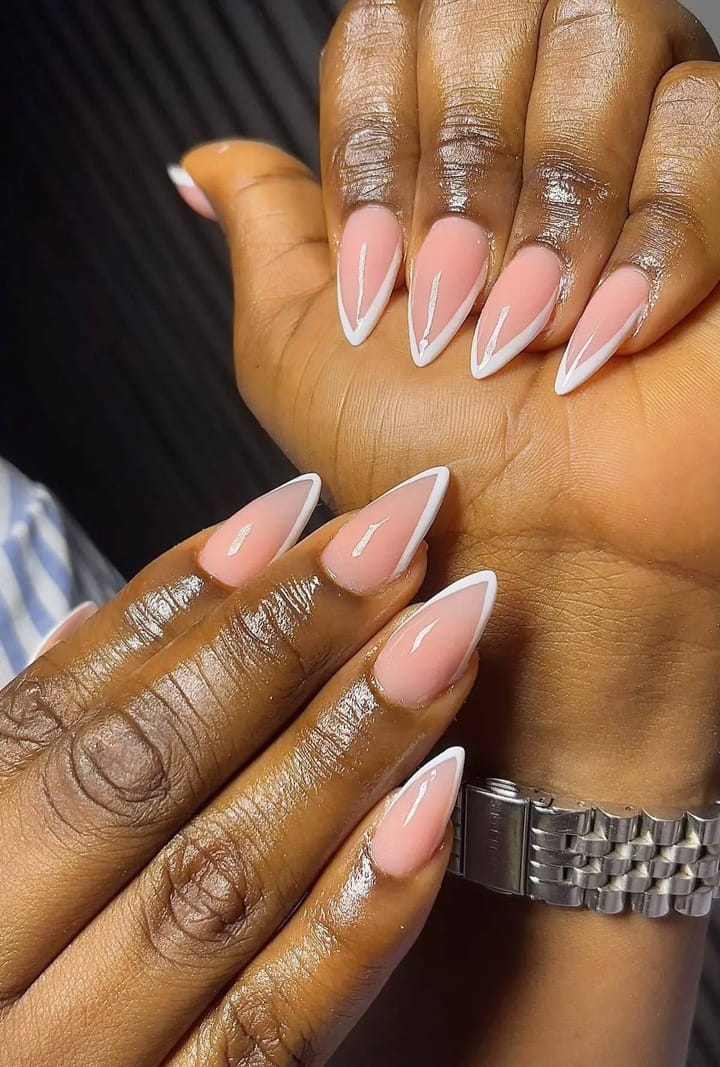 Long nude stiletto gel set with crisp white French tips