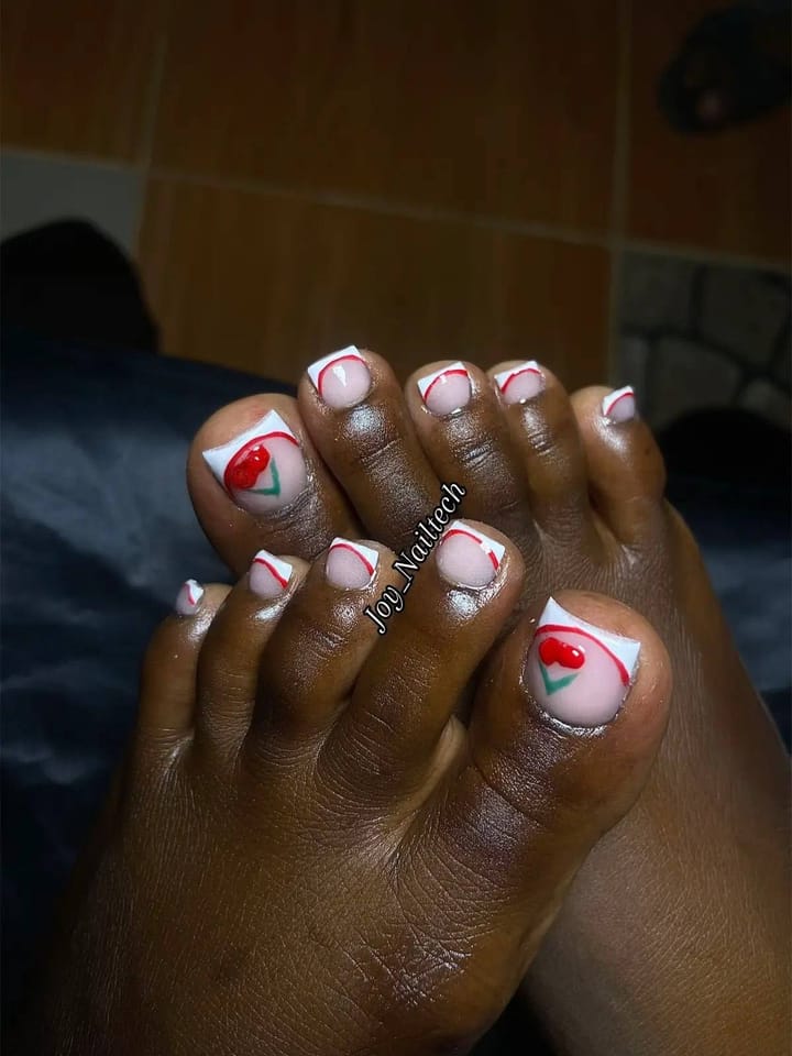 Toe nails with white French tips and hand-painted cherries